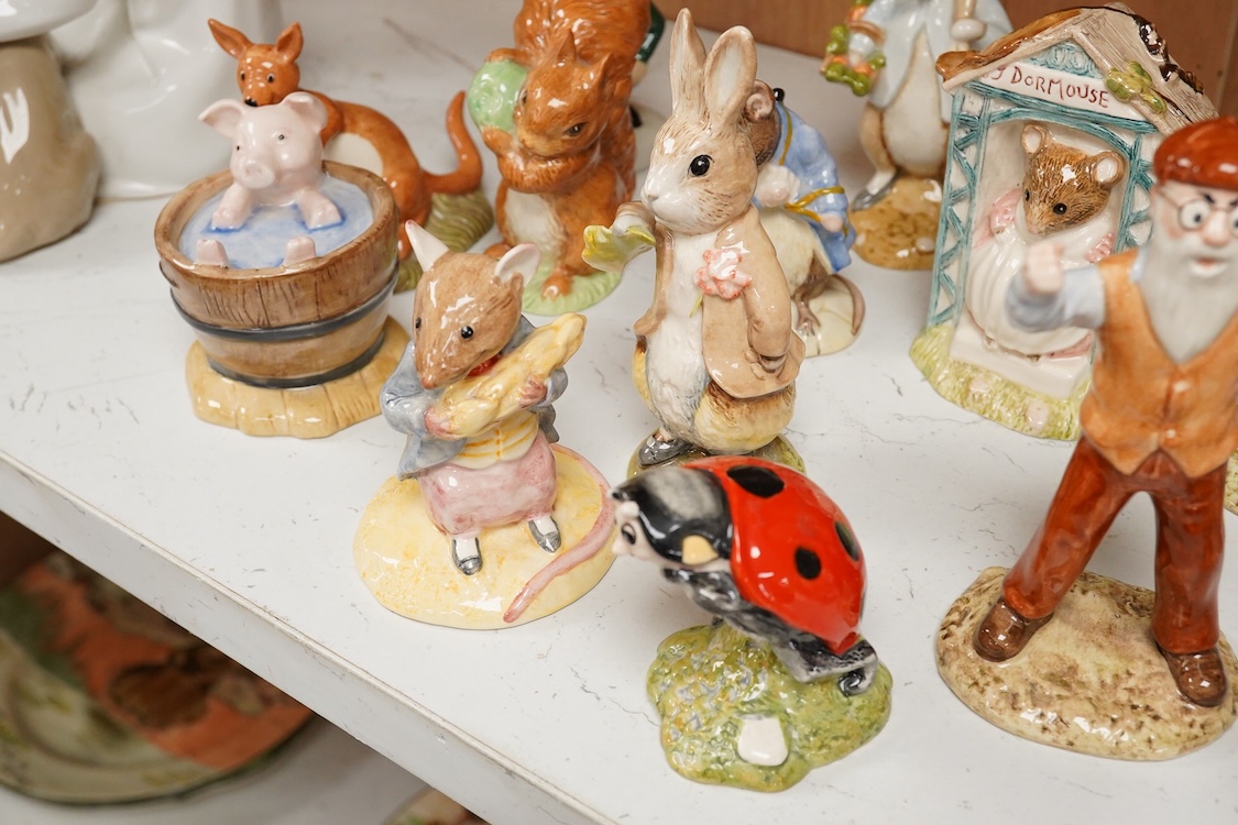 A collection of eighteen mixed Royal Doulton and Royal Albert figures of Beatrix Potter characters, largest 13cm high